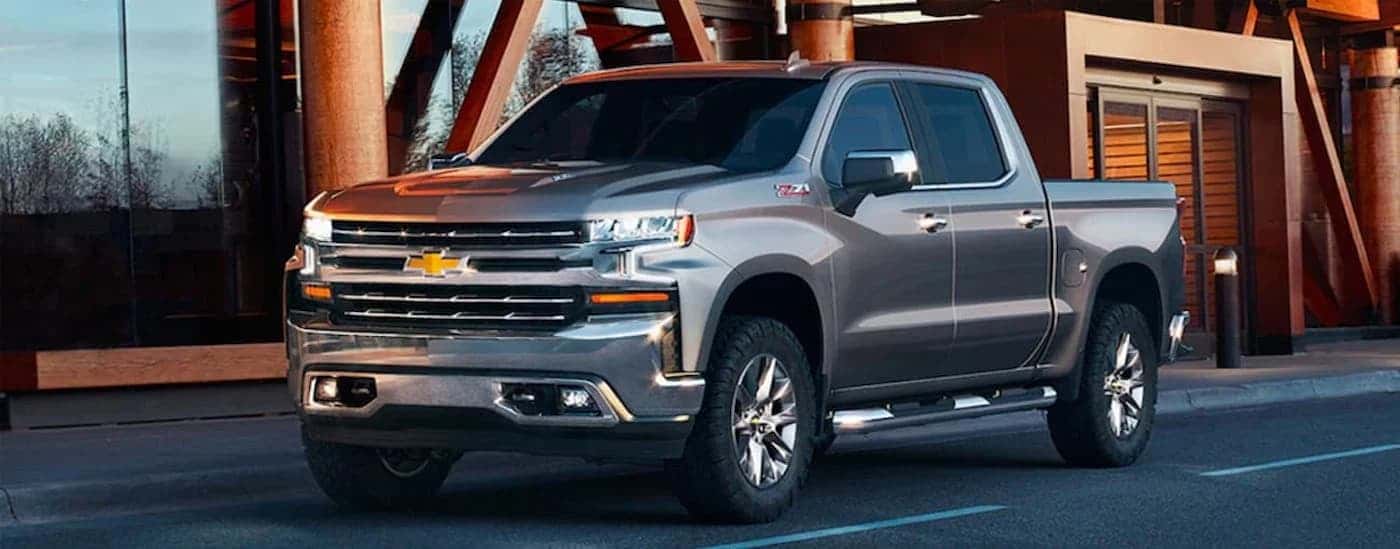 Silver 2019 Chevy Silverado 1500 parked near a building.