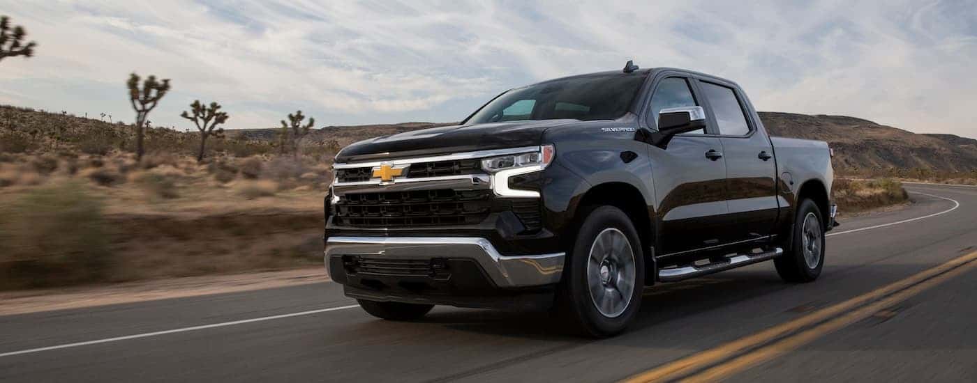 A black 2022 Chevy Silverado 1500 LT is shown from the front at an angle