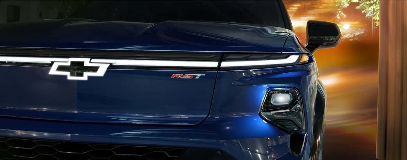 Close-up of a blue 2024 Chevy Silverado EV RST grille