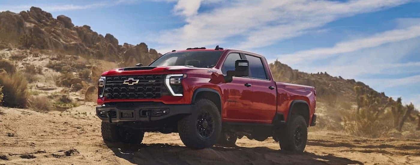 A red 2024 Chevy Silverado 2500 HD ZR2 Bison is shown from the front at an angle.