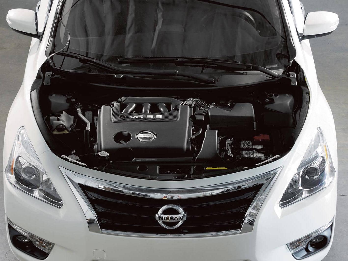 Nissan Vehicle with engine exposed.