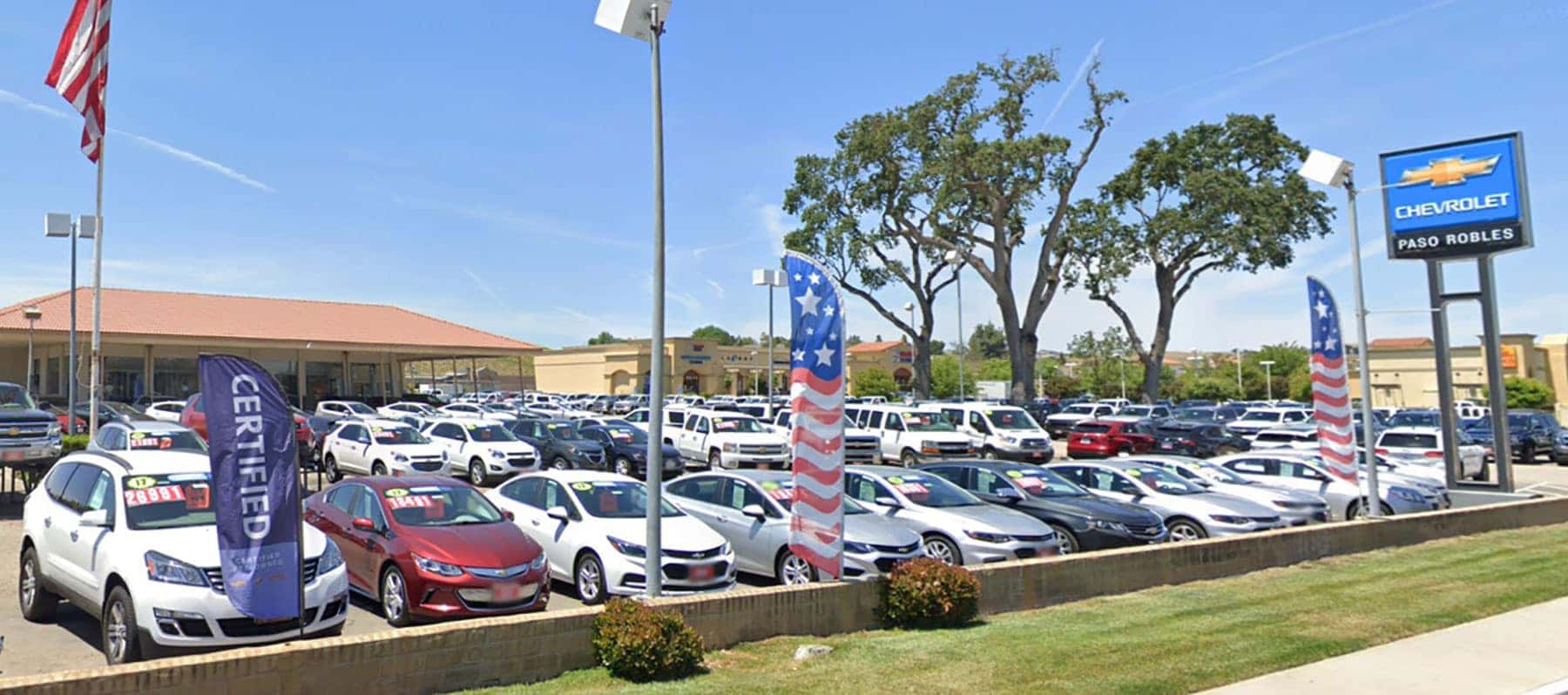An exterior shot of a Chevrolet dealership during the day