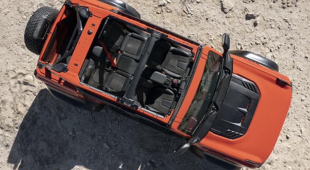 An orange 2022 Ford Bronco is shown from above.
