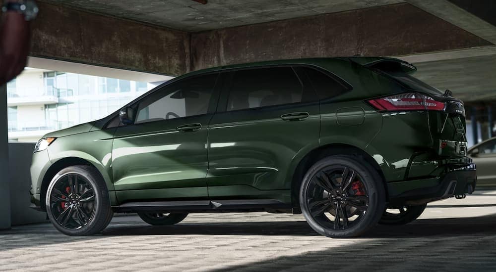 A green 2022 Ford Edge is shown from the side parked in a parking garage.