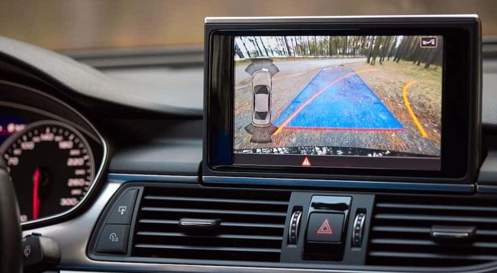 A rearview camera screen is shown.