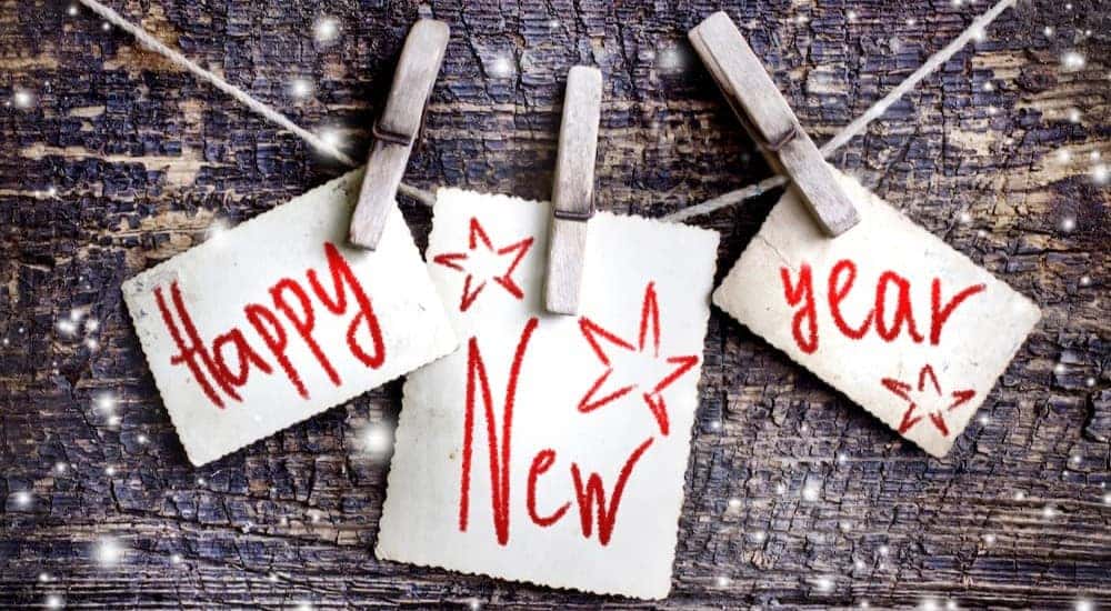 A Happy New Year sign is shown.