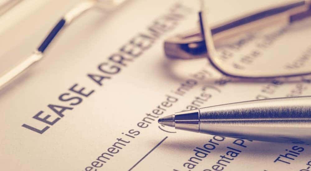 A pen is shown on top of a lease agreement.