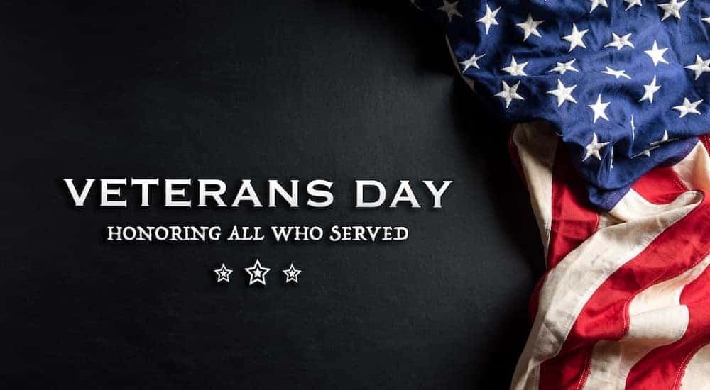 A flag is shown honoring all veterans who served.
