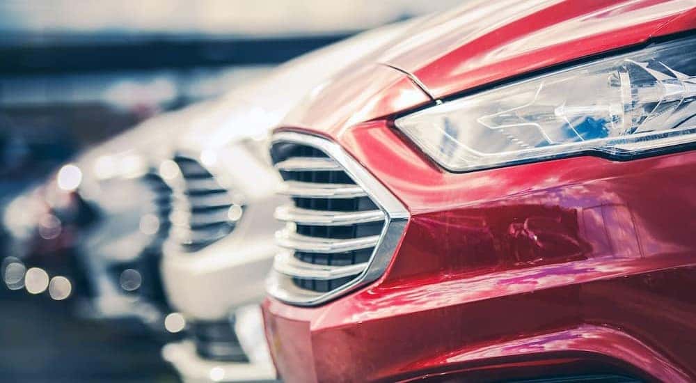 A row of pre-owned cars is shown.