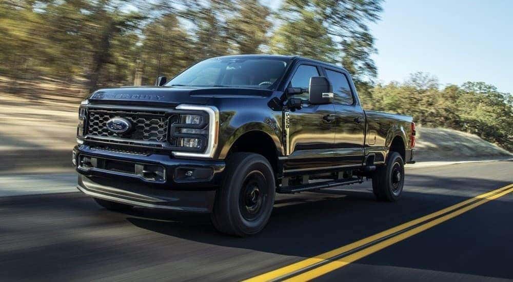 A Ford F-250 XL STX is shown driving down a road.
