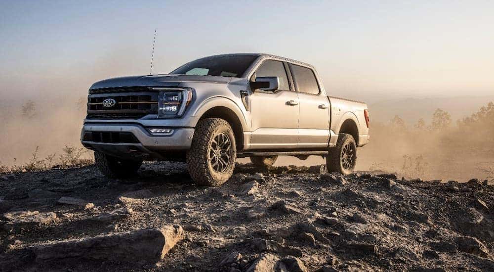 A silver 2022 Ford F-150 Tremor is shown off-roading after visiting an Indianapolis Ford dealer.