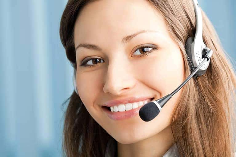 A woman wearing a headset to communicate via phone call