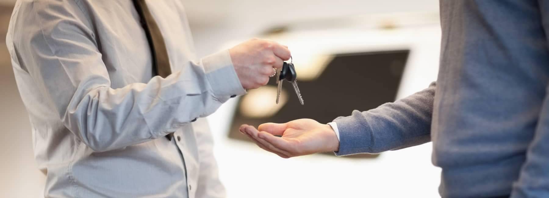Person handing other person car keys 2