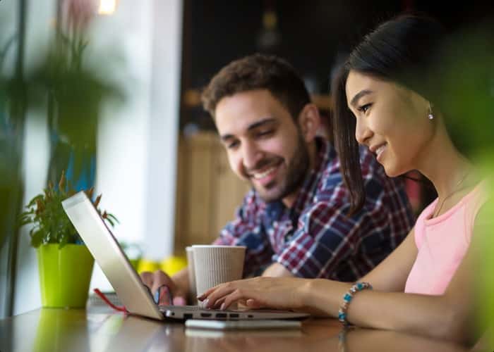 Couple looking at computer.