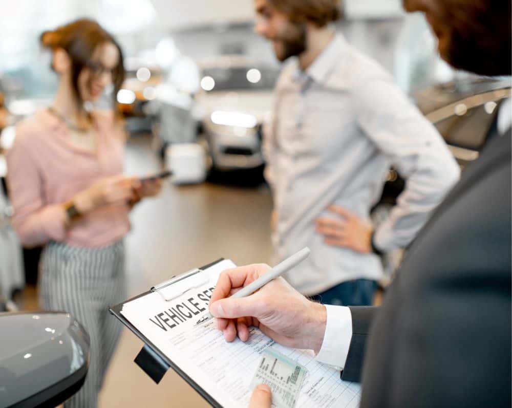 customers at car dealership