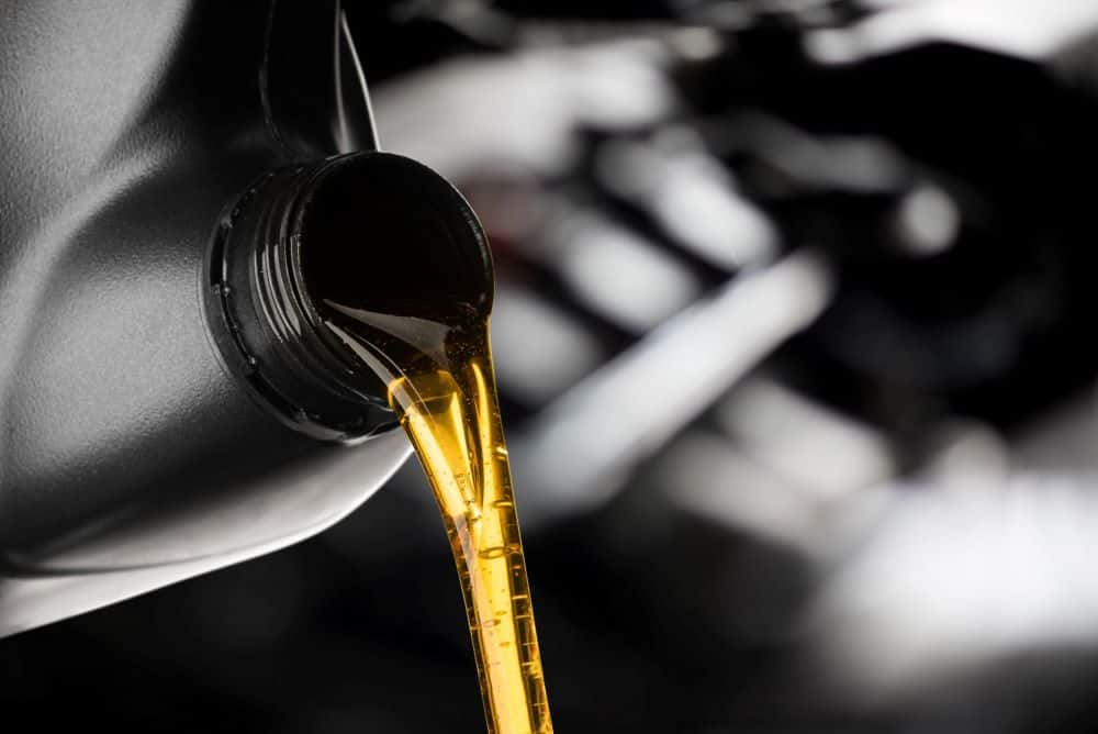 close up of motor oil being poured