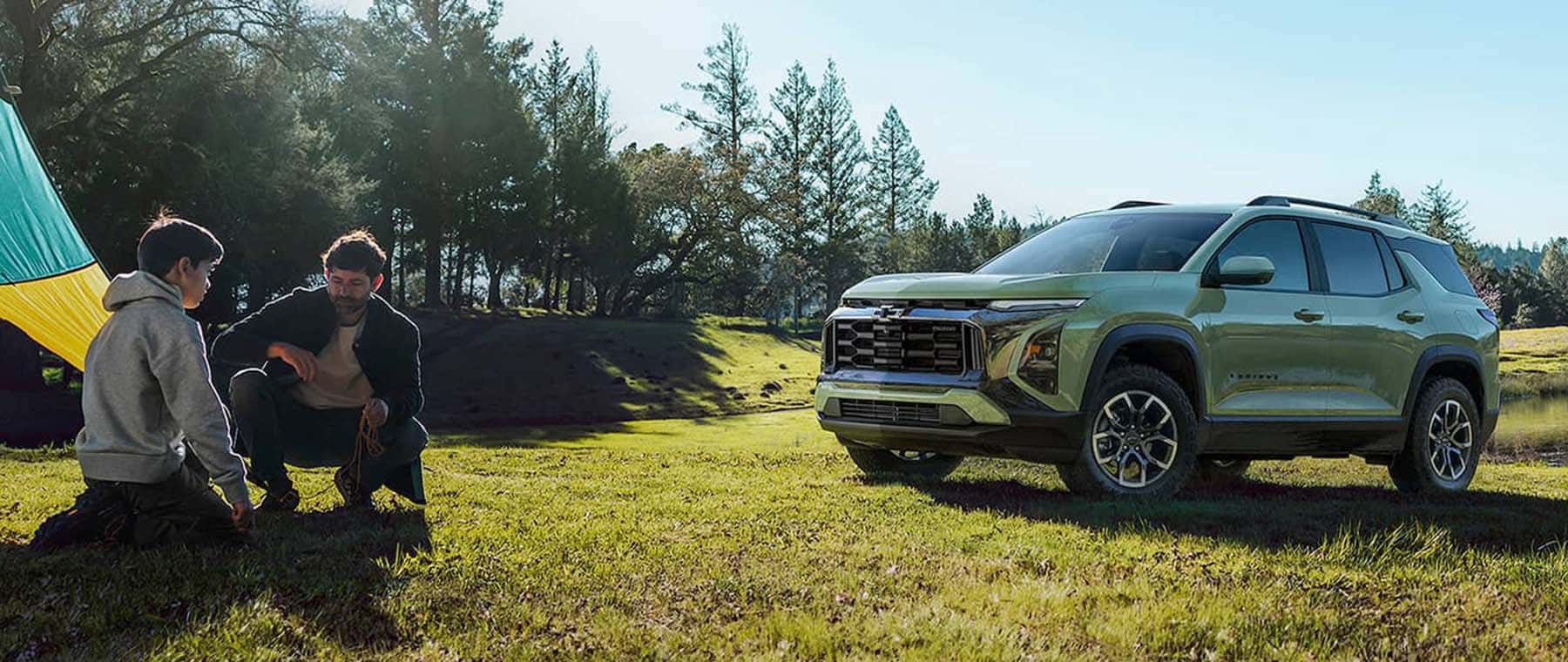 2026-chevrolet-equinox-with-people-camping-mobile