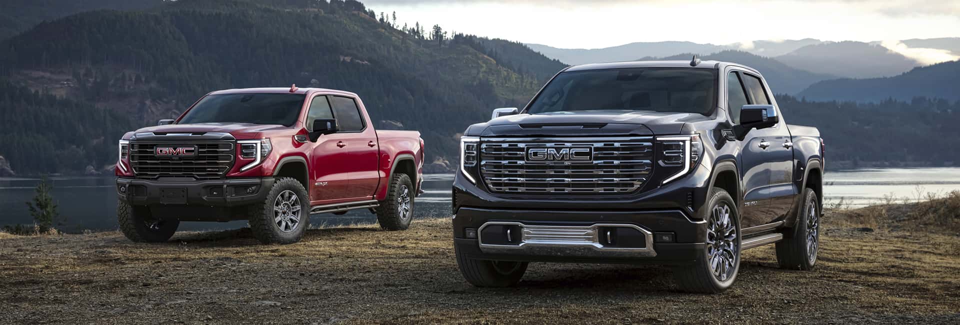 GMC Pickups in front of a lake-mobile