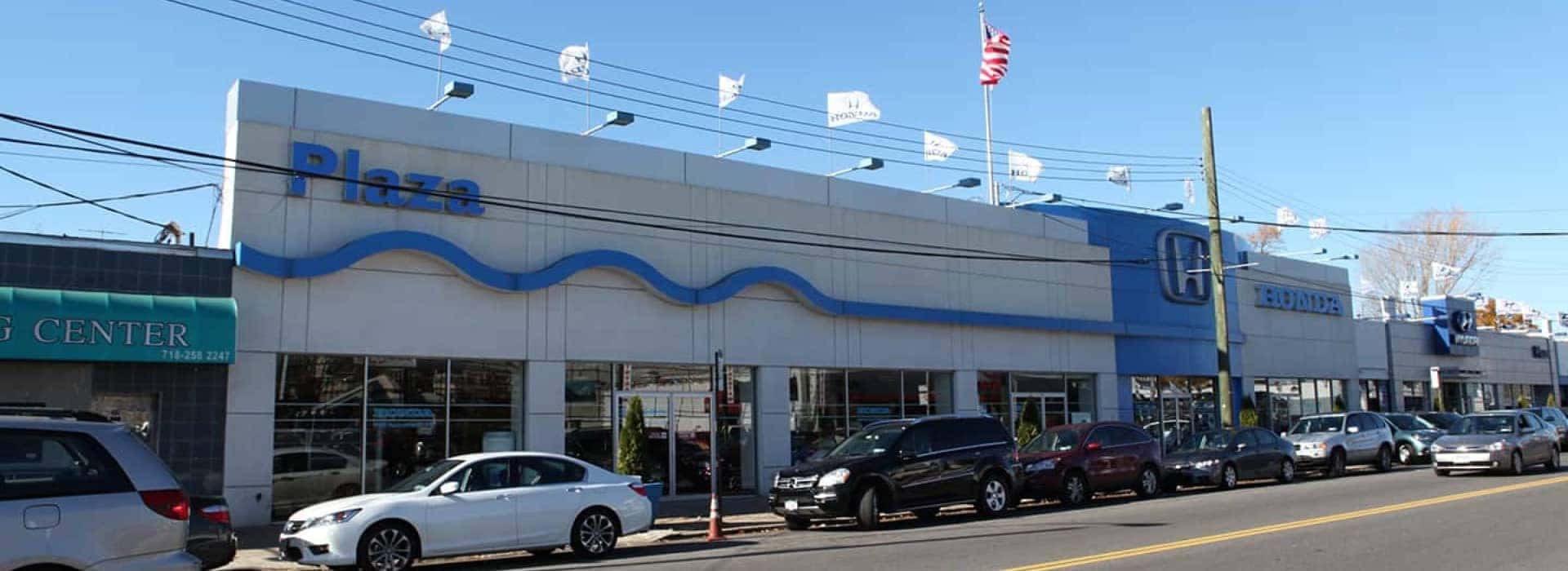 An exterior shot of the Plaza Honda Dealership building