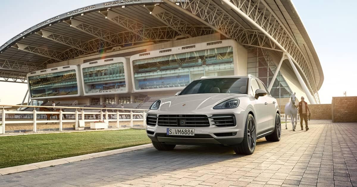 Porsche-Cayenne-Parked-in-front-of-horse-track