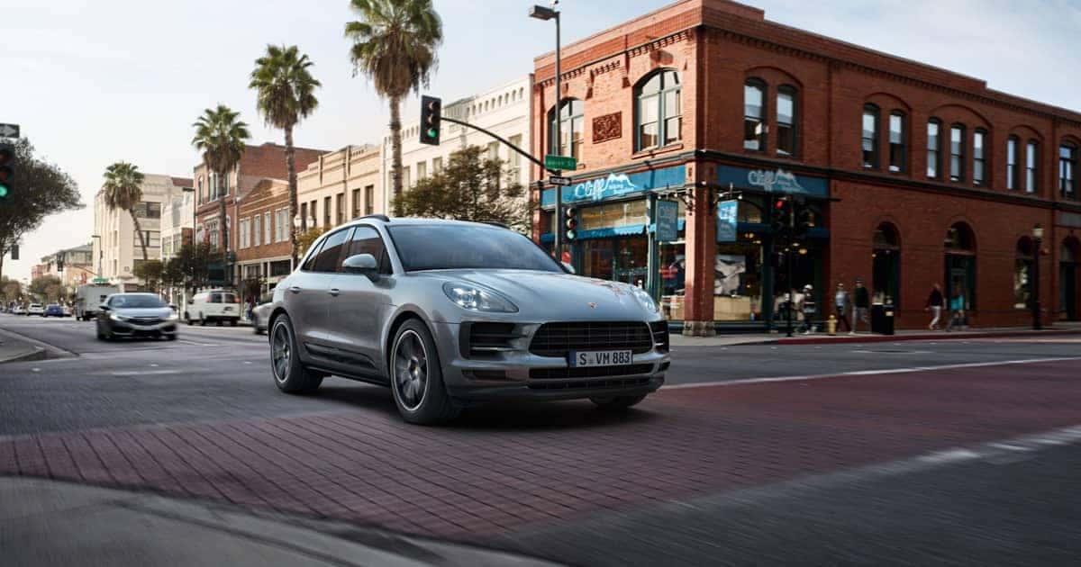 Porsche-Macan-driving-through-a-downtown-street