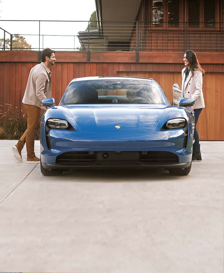 Two people getting into car