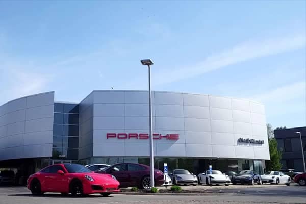 Exterior shot of a modern Porsche dealership