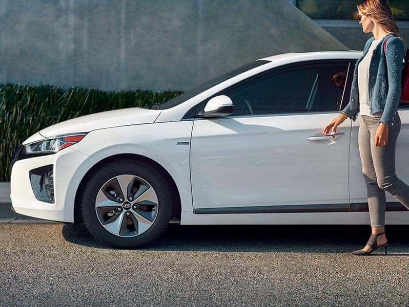 Woman opening the door to her hyundai