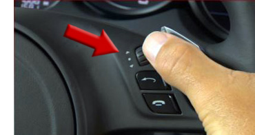 How do I adjust the clock in my Porsche - Step 1 - Locate the Porsche Multi-Function Steering Wheel rotary knob
