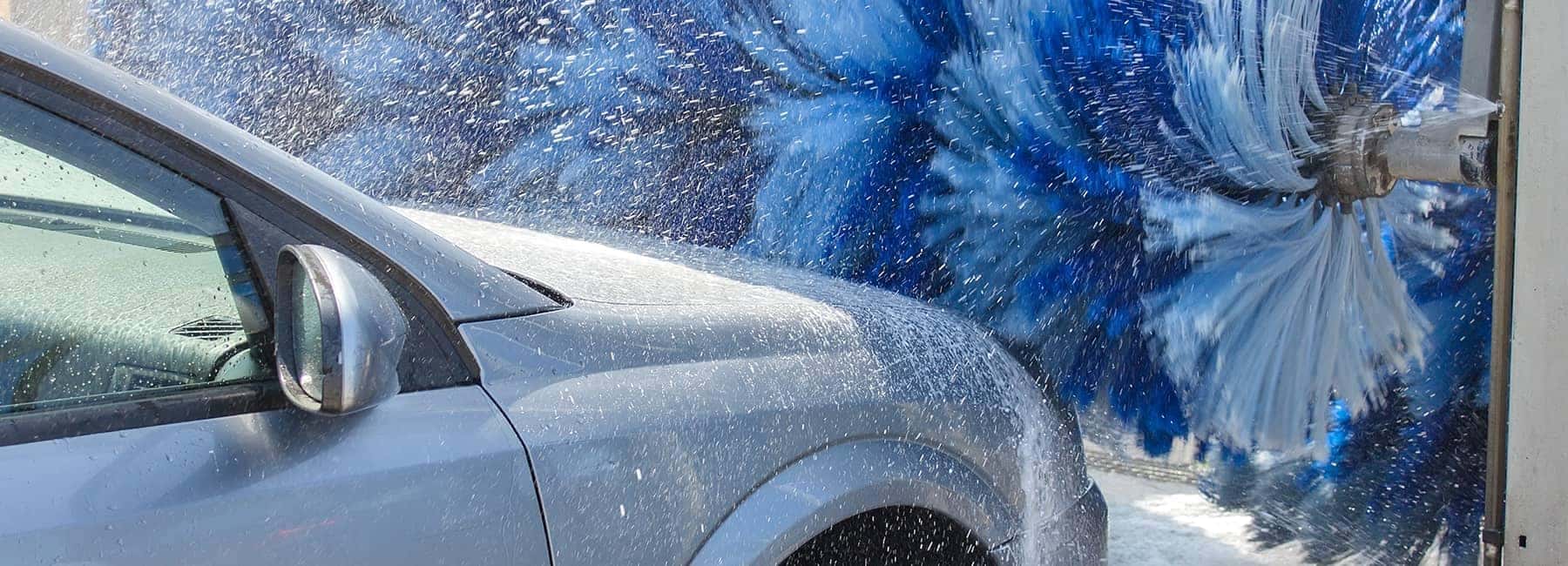 car driving through car wash