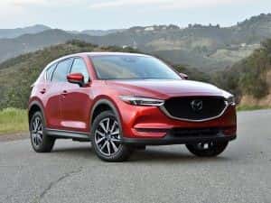 Red Mazda CX-5 by mountains