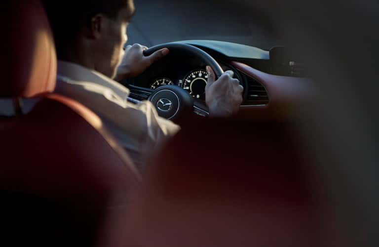 man driving his 2021 Mazda3 2.5 Turbo