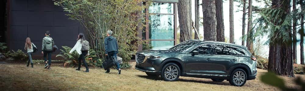 family walking away from 2021 Mazda CX-9