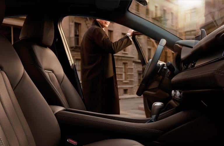 man getting out of the 2020 Mazda6