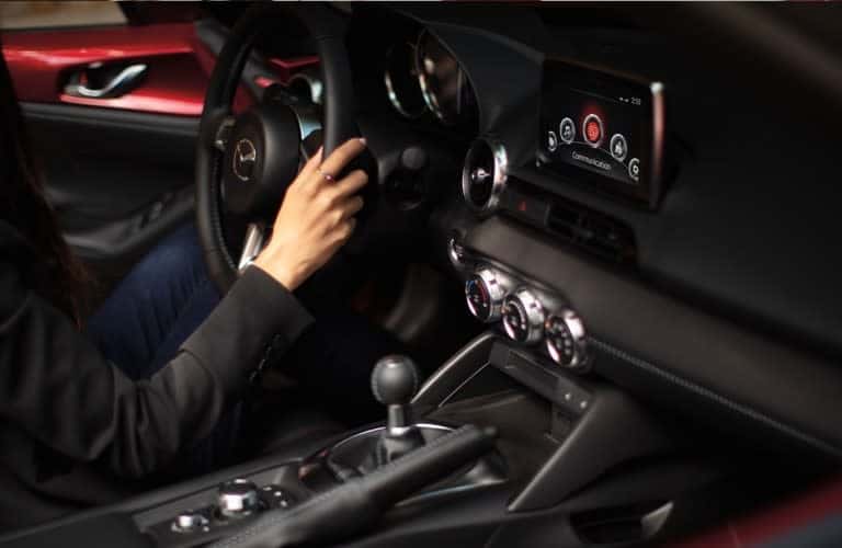 person sitting in the interior of the 2020Â Mazda Miata
