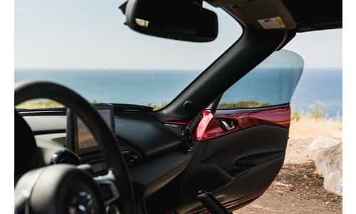 2019 Mazda MX-5 Miata passenger door open by the beach