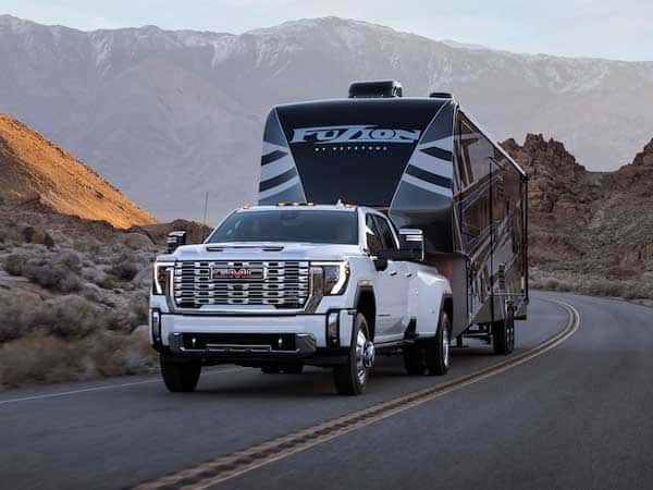 2025 GMC Sierra HD towing a camper