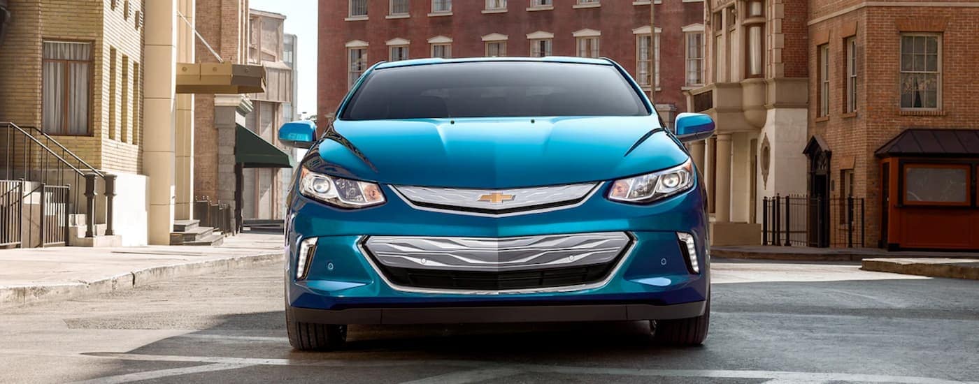 A blue 2019 Chevy Volt is parked on a city street after leaving a Chevy dealership in Bethlehem, PA.