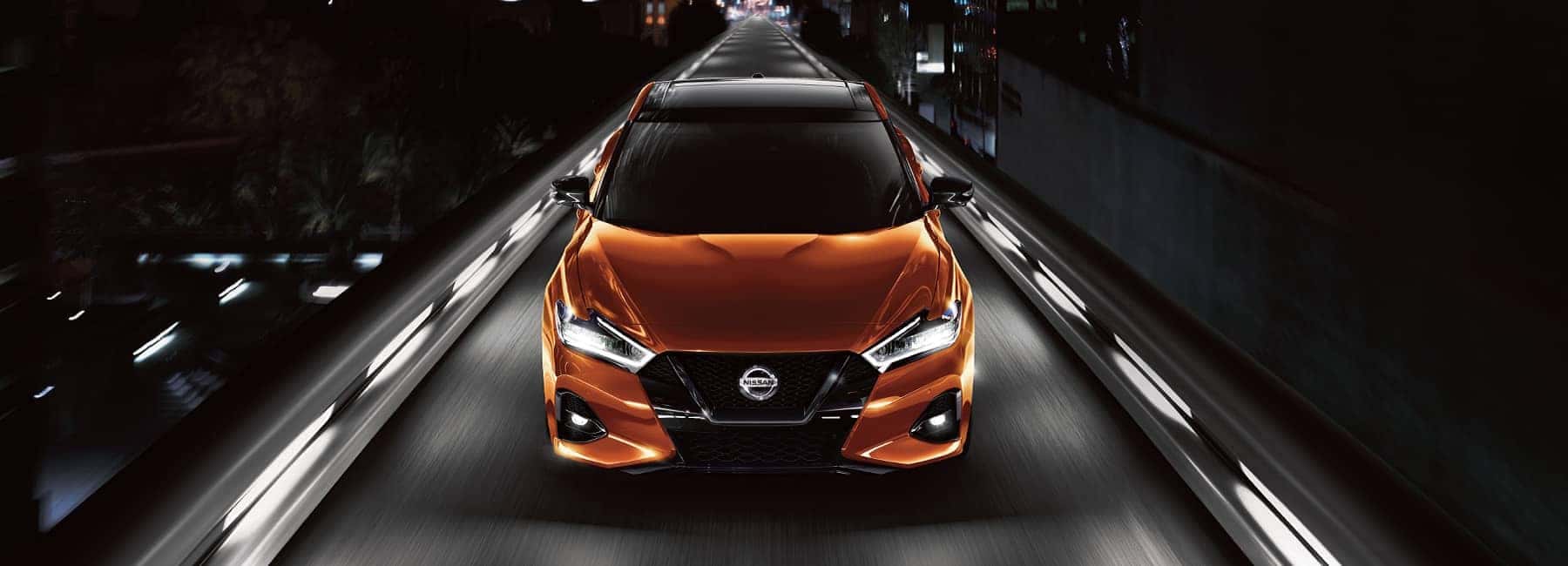 Sunset Drift 2022 Nissan Maxima on a city street at night
