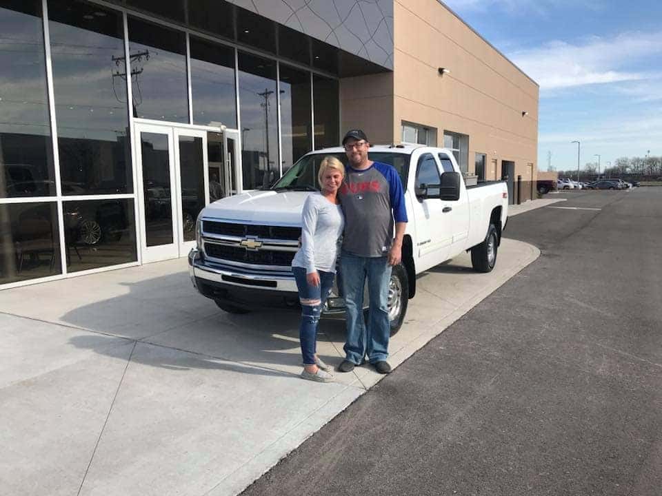 a couple with their new car