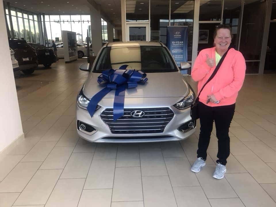 woman with her new car