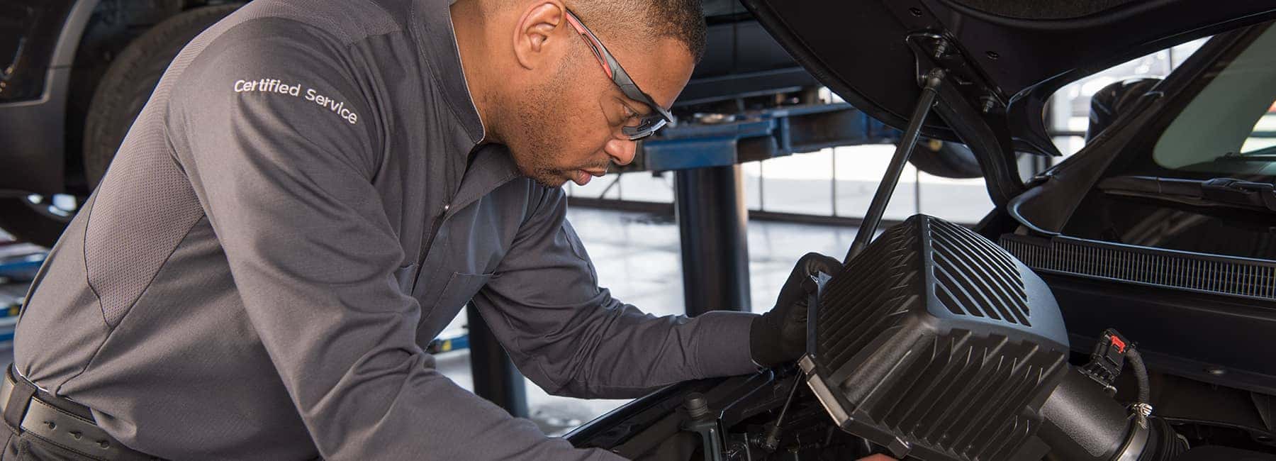 Certified-technician-inspects-car-engine