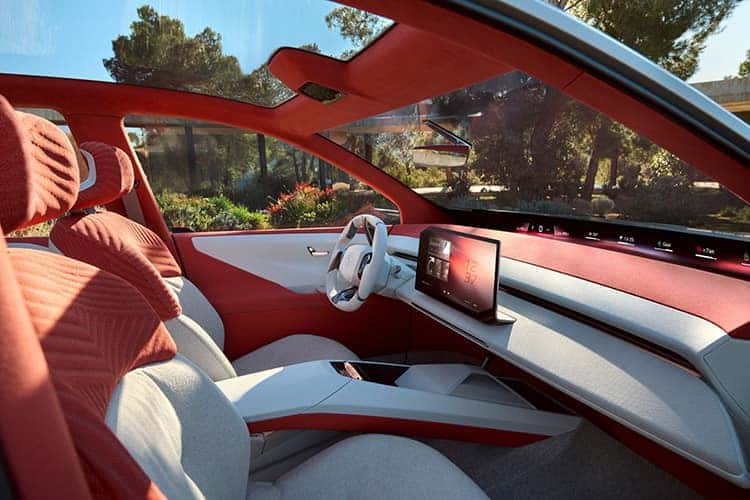 The red and grey interior is shown in a BMW Vision Neue Klasse X.