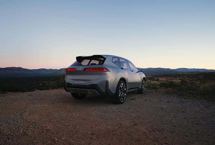 A silver BMW Vision Neue Klasse X is shown from the rear.