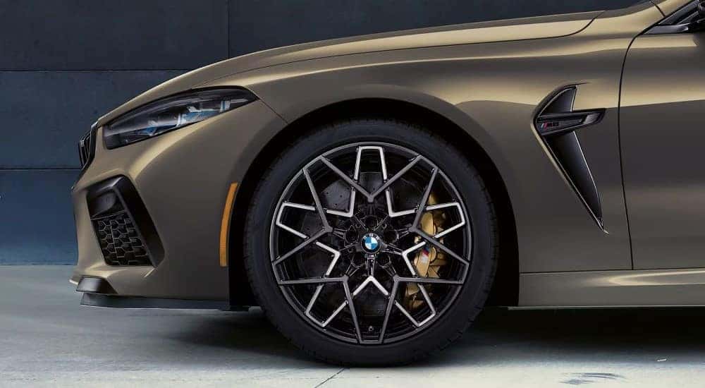 A close up shows a rim on a 2024 BMW M8 after visiting a BMW dealer in McKinney.