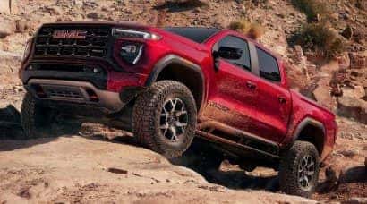2026 GMC Canyon parked on red rocks desktop