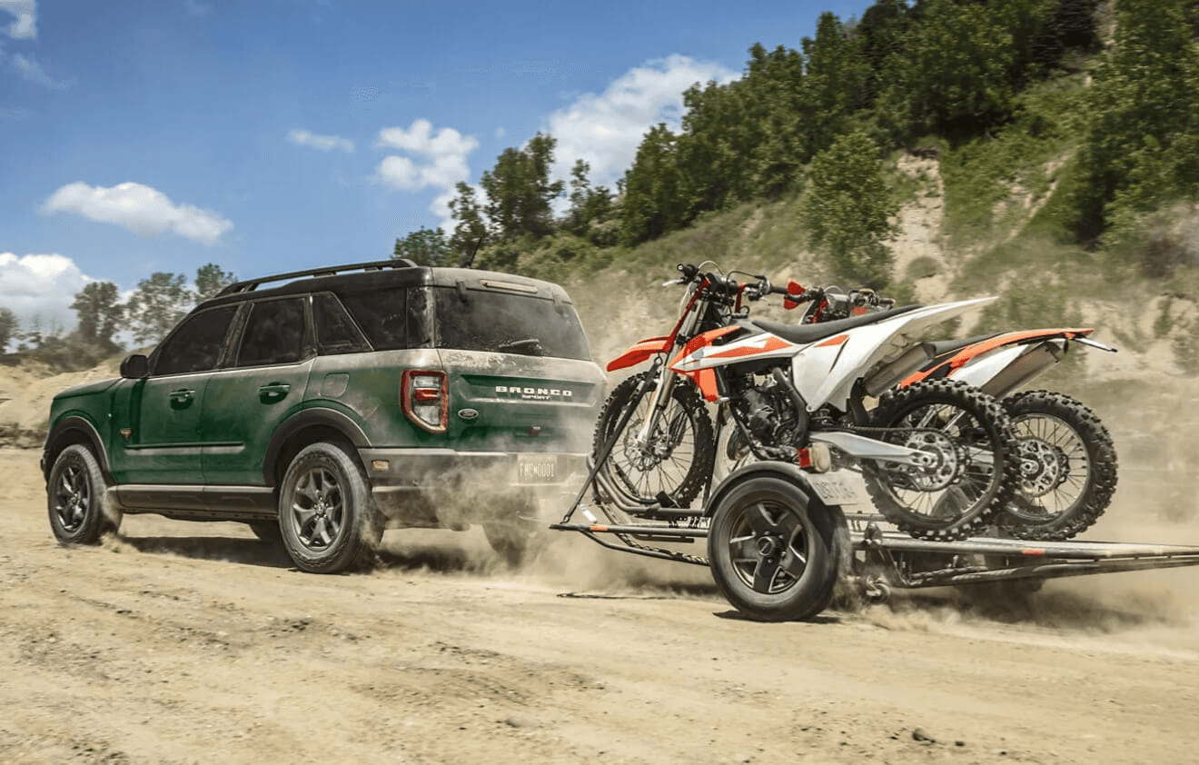 Bronco Sport pulling a trailer of motor bikes