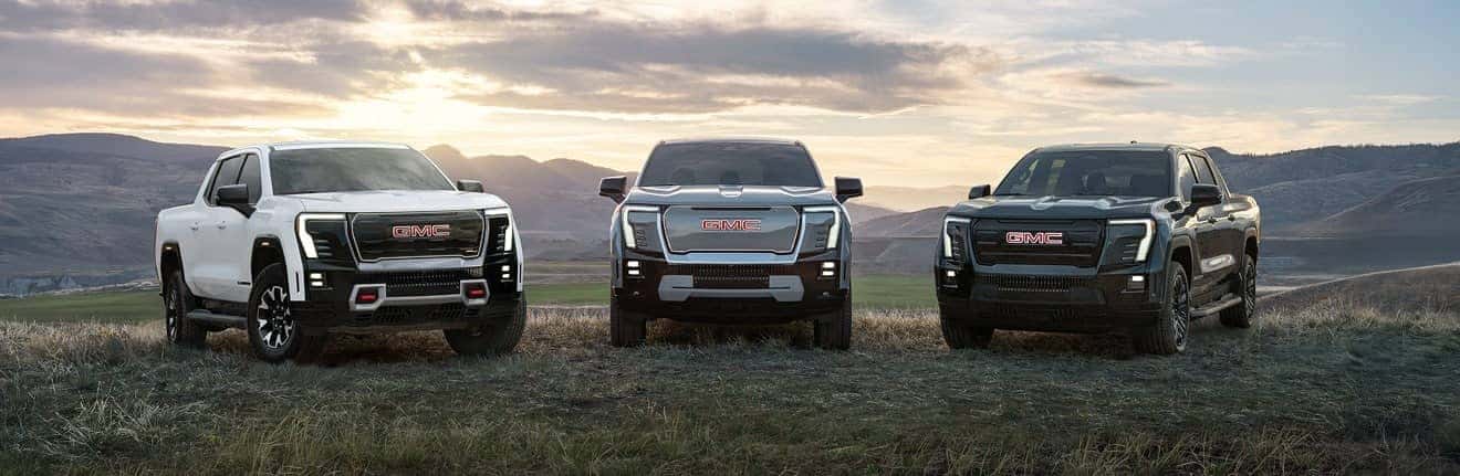 A lineup of GMC trucks outside