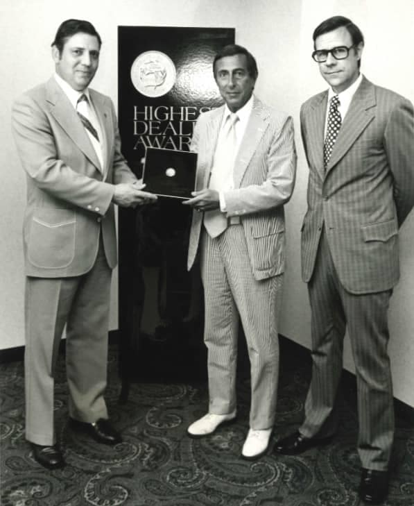 Bob Sight (center) receiving the “Highest Dealer Award” from Lincoln Mercury representatives