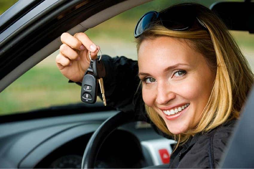 Woman holding car keys